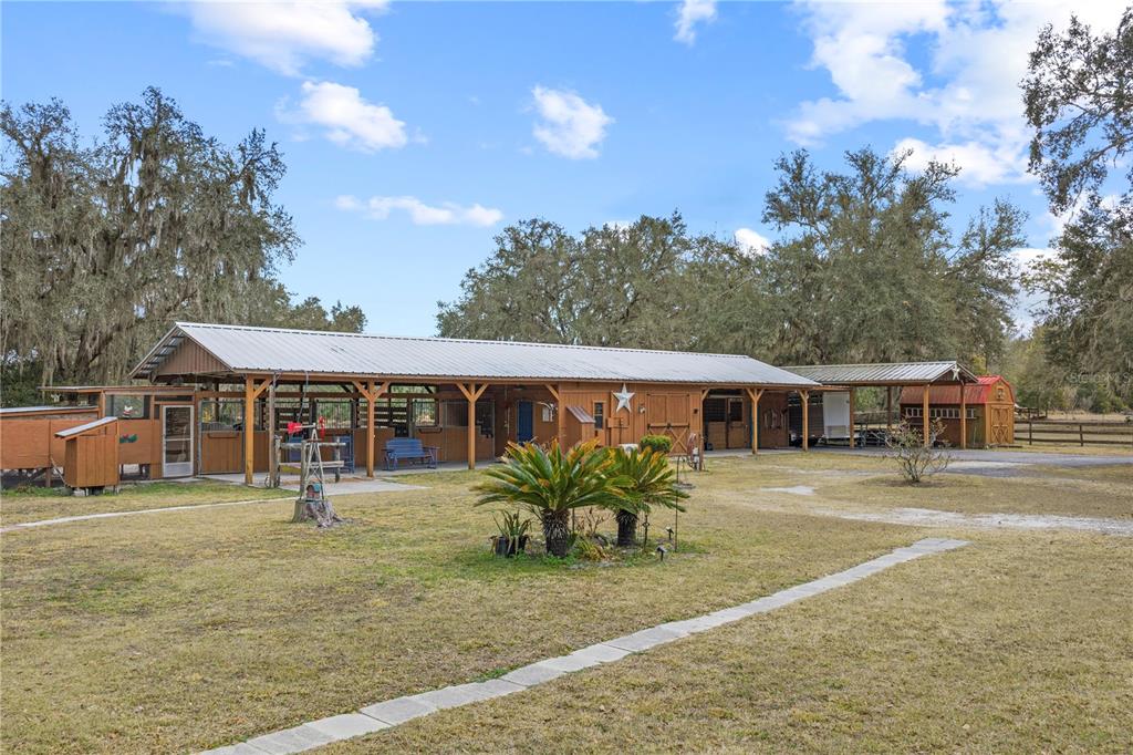 4292 Southwest 73rd Trail Bushnell, FL 33513 - Photo 49 of 88 a front view of a house with a yard