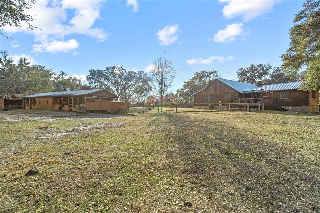 4292 Southwest 73rd Trail Bushnell, FL 33513 - Photo 74 of 88 a front view of house with yard and trees around