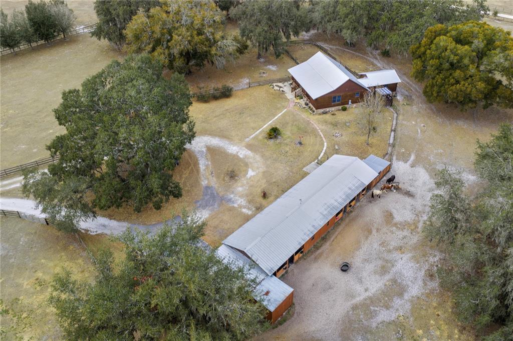4292 Southwest 73rd Trail Bushnell, FL 33513 - Photo 75 of 88 an aerial view of a house with a yard and lake view
