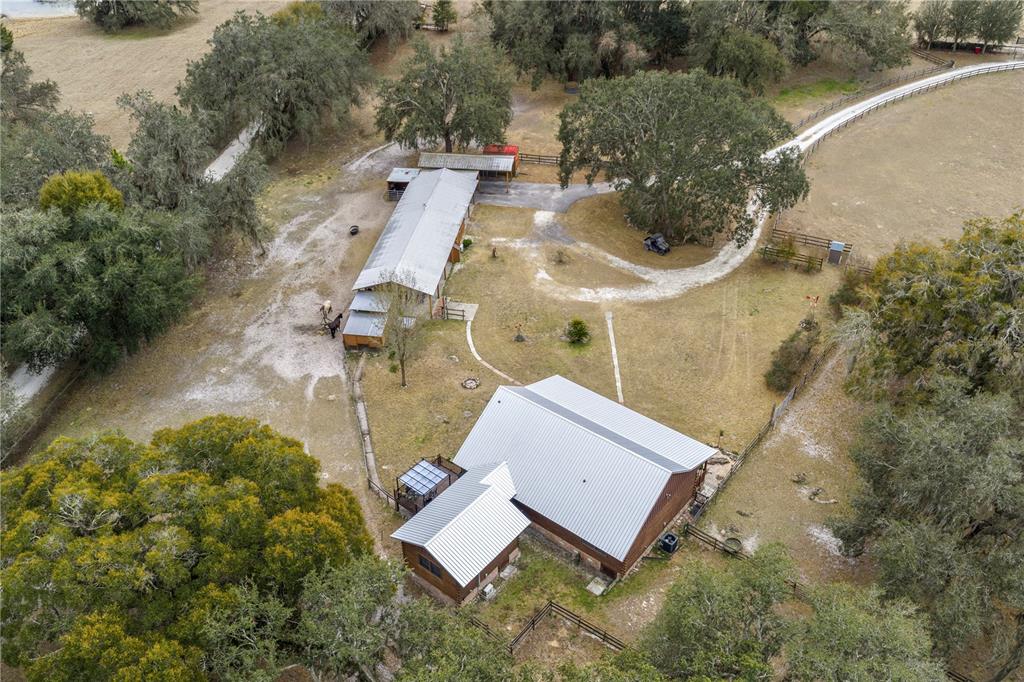 4292 Southwest 73rd Trail Bushnell, FL 33513 - Photo 76 of 88 an aerial view of residential house with outdoor space and parking