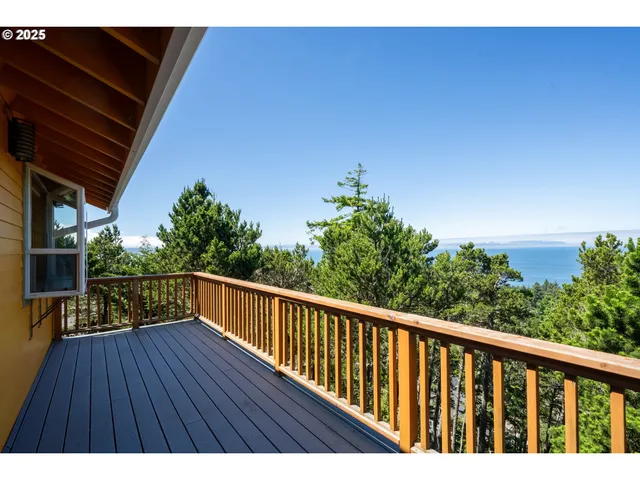 a view of balcony with wooden floor and outdoor space