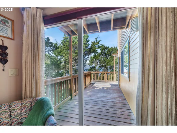 a view of room with furniture and windows