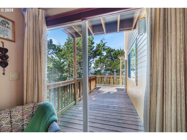 a view of room with furniture and windows