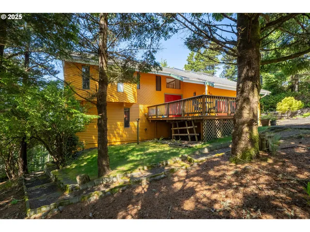 a view of a house with a tree