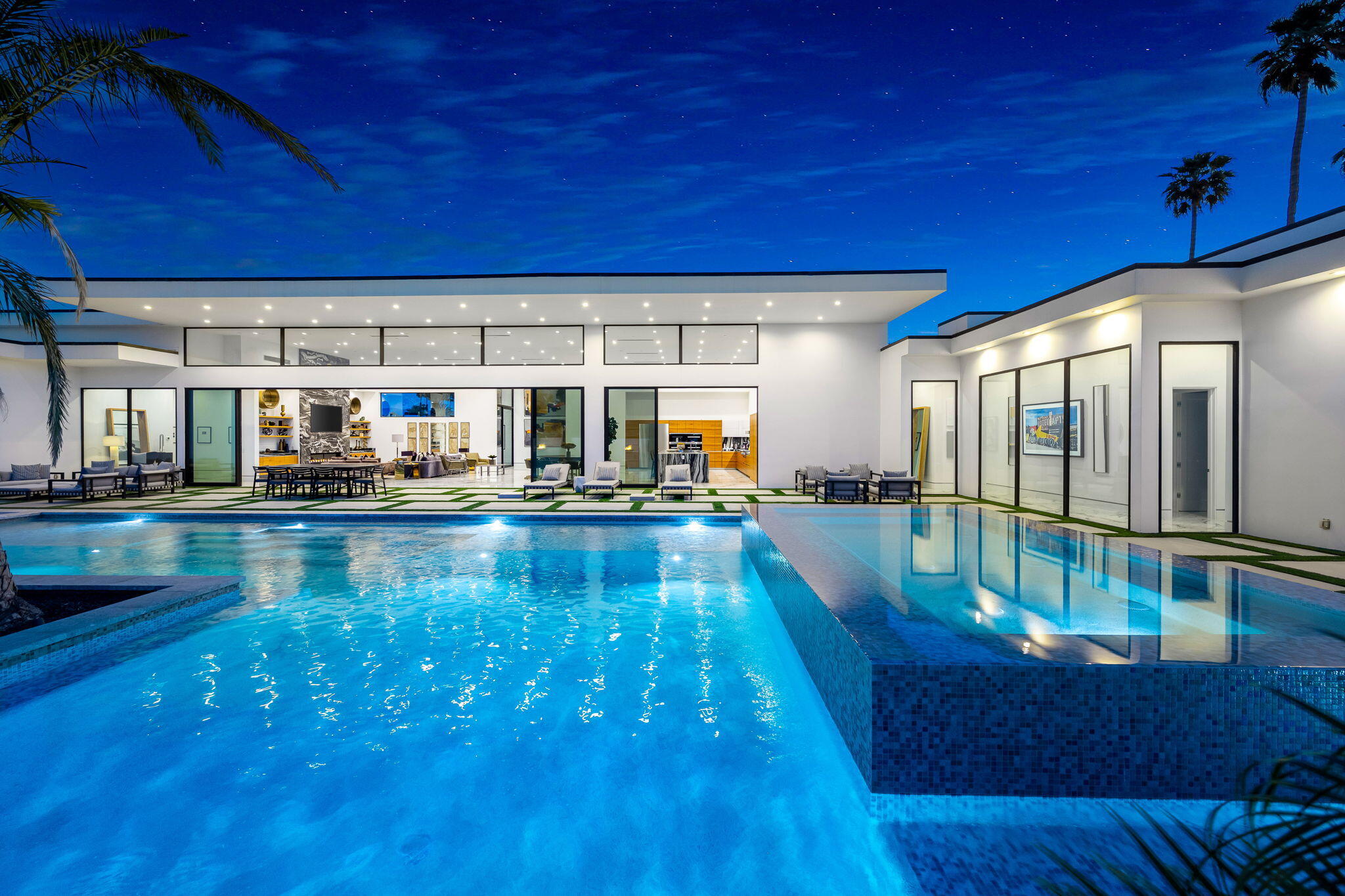 a view of a swimming pool with seating area