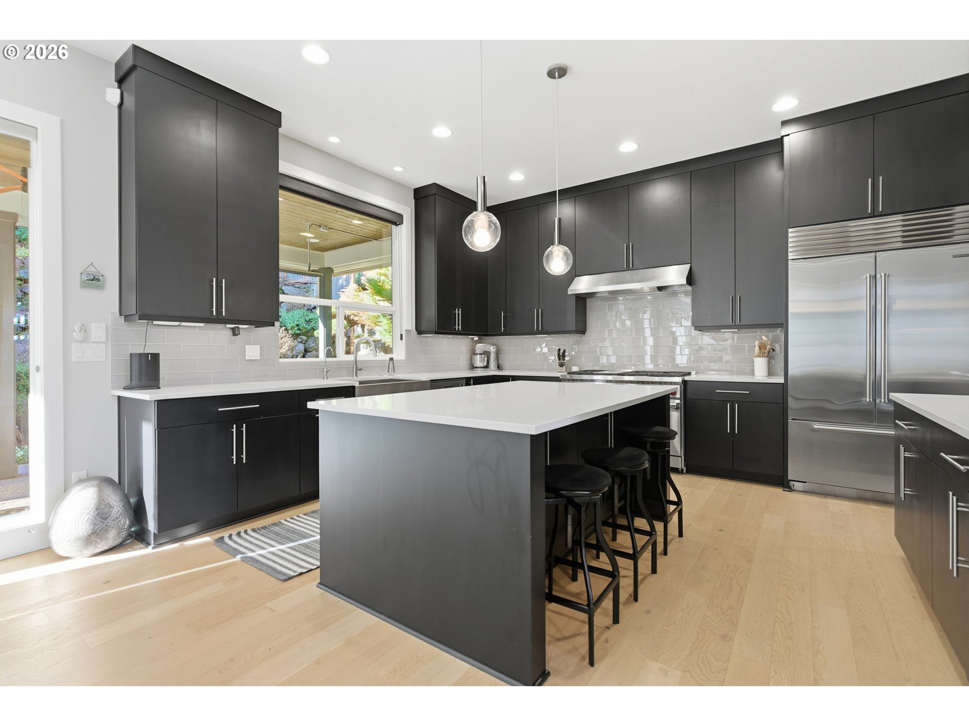 2123 South Military Road Portland, OR 97219 - Photo 14 of 47 a kitchen with kitchen island a sink stainless steel appliances and cabinets