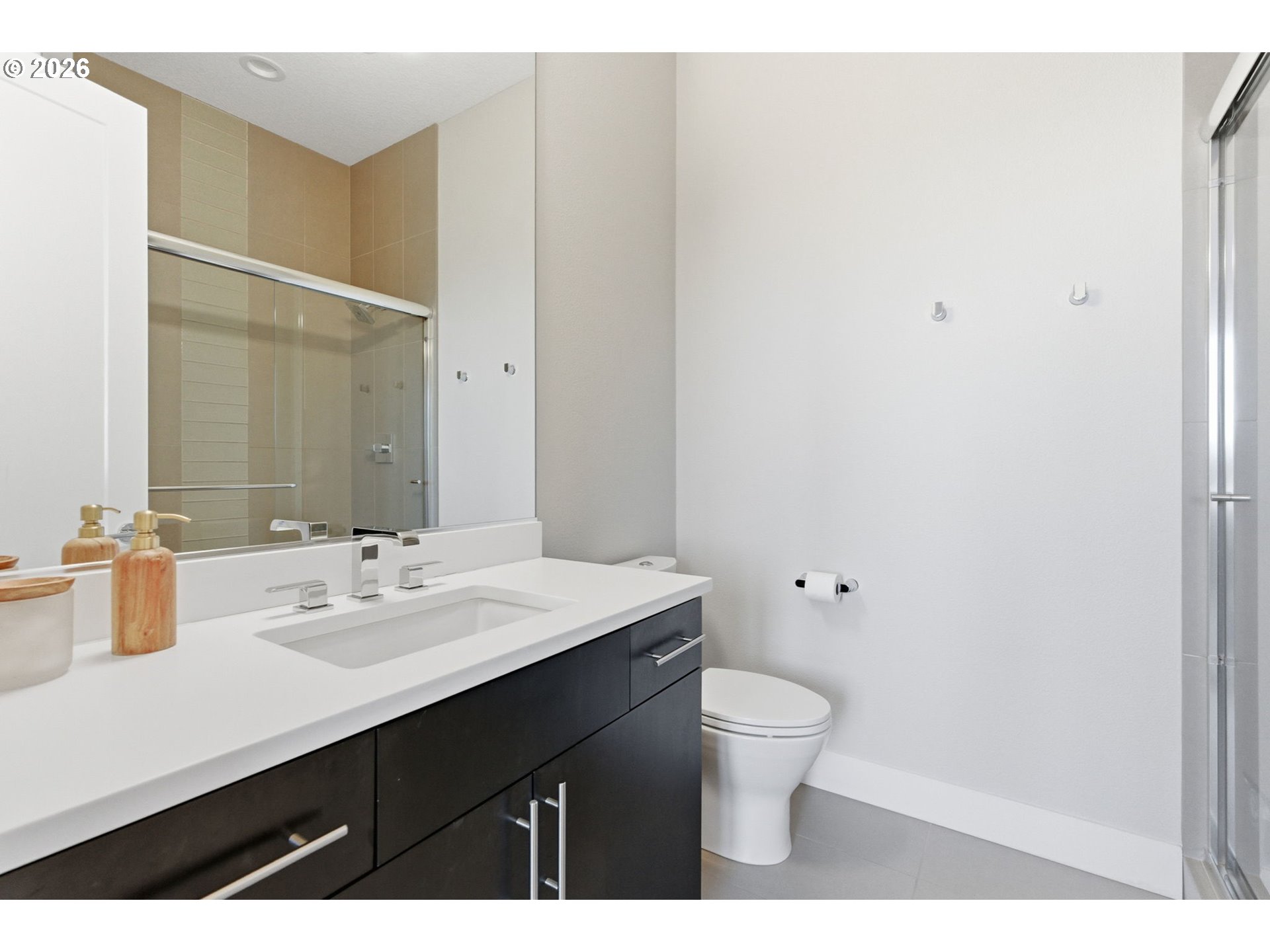 2123 South Military Road Portland, OR 97219 - Photo 23 of 47 a bathroom with a sink a toilet a shower and a mirror