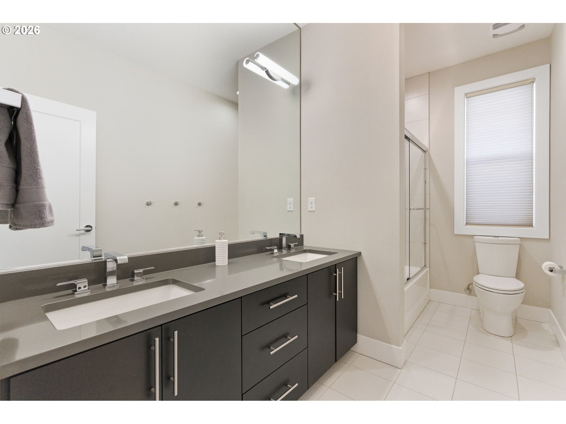 2123 South Military Road Portland, OR 97219 - Photo 32 of 47 a bathroom with a double vanity sink and a mirror