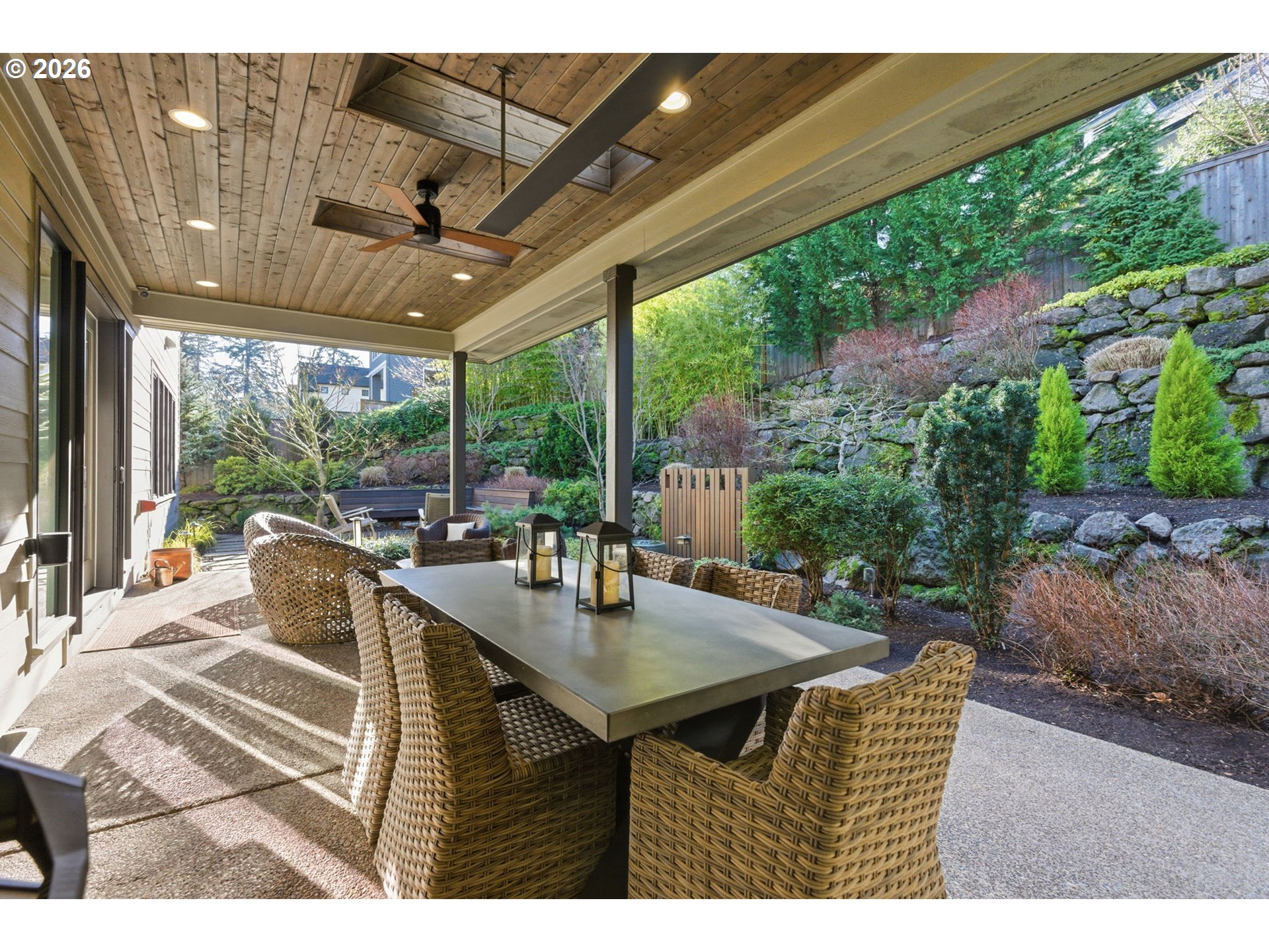 2123 South Military Road Portland, OR 97219 - Photo 38 of 47 a view of a patio with a table chairs and a backyard