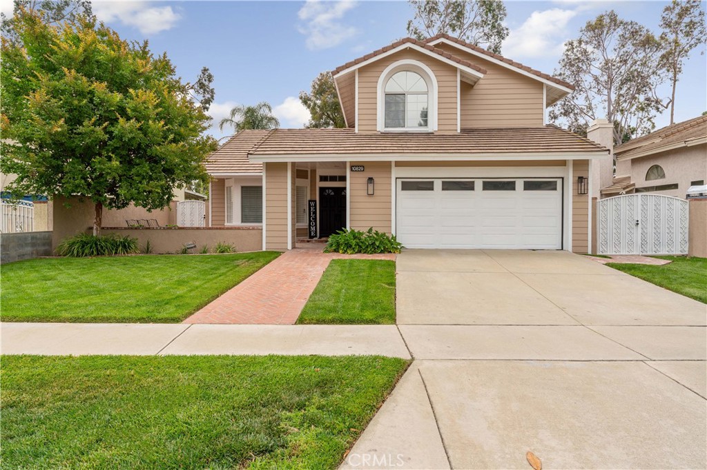 10829 Zinfandel Street Rancho Cucamonga, CA 91737 - Photo 1 of 1 a front view of house with yard and green space