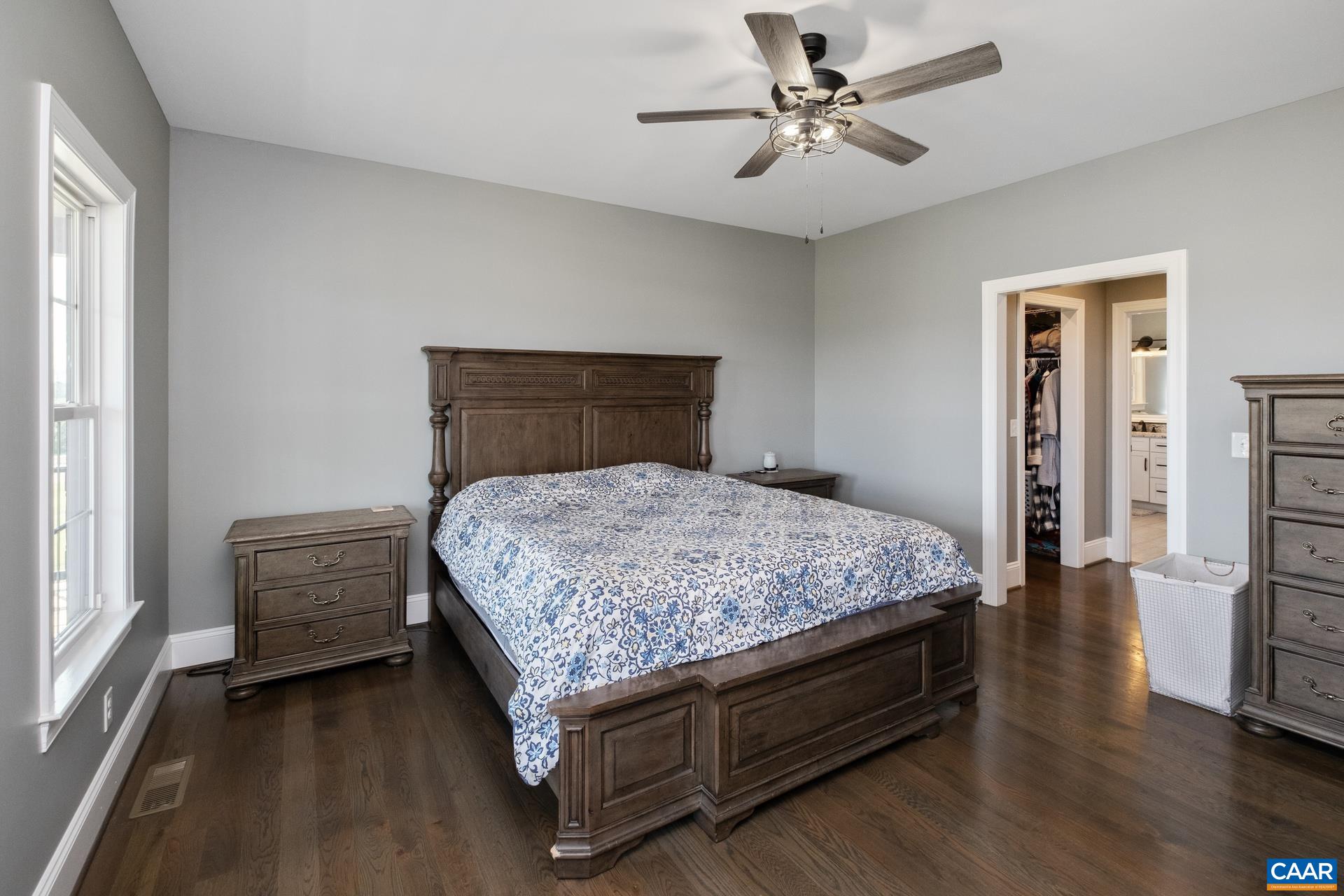 728 Long Meadow Road Fishersville, VA 22939 - Photo 14 of 52 a bedroom with a bed and a chandelier