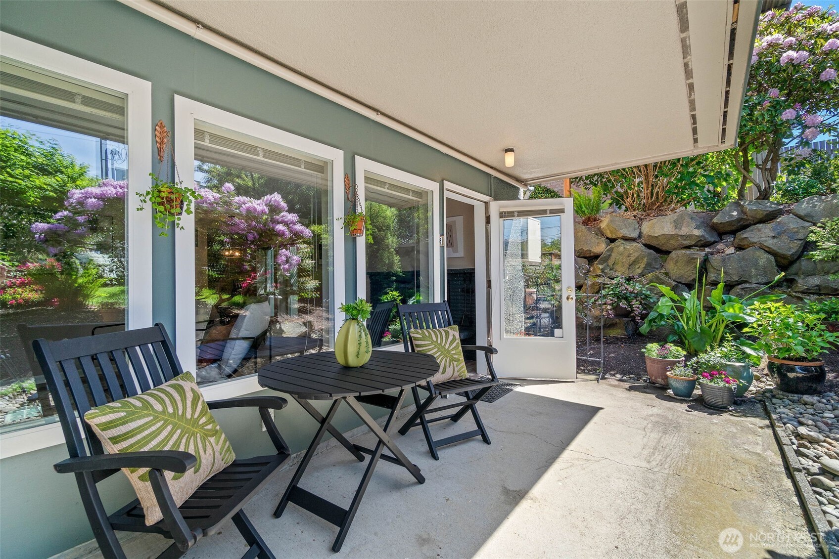 75 East Lynn Street, Unit B Seattle, WA 98102 - Photo 1 of 36 a view of an outdoor dining space with a patio