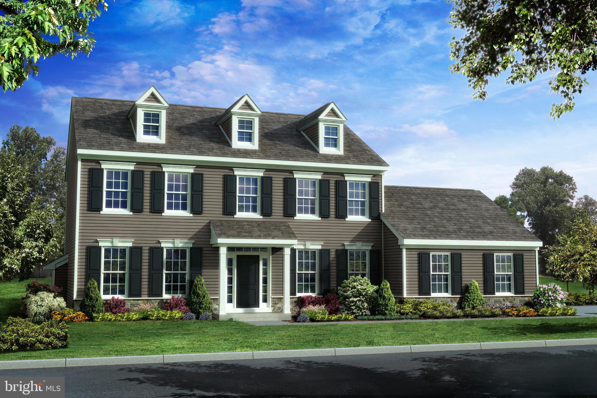 front view of a brick house with a yard