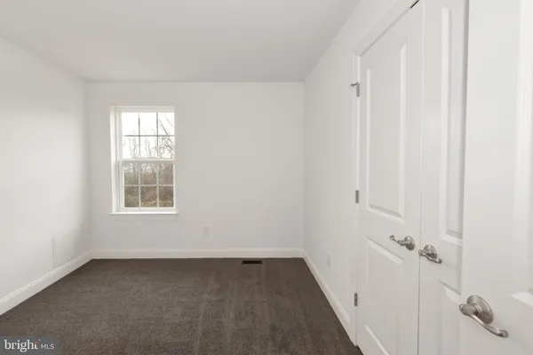 a view of a room that has a window in it