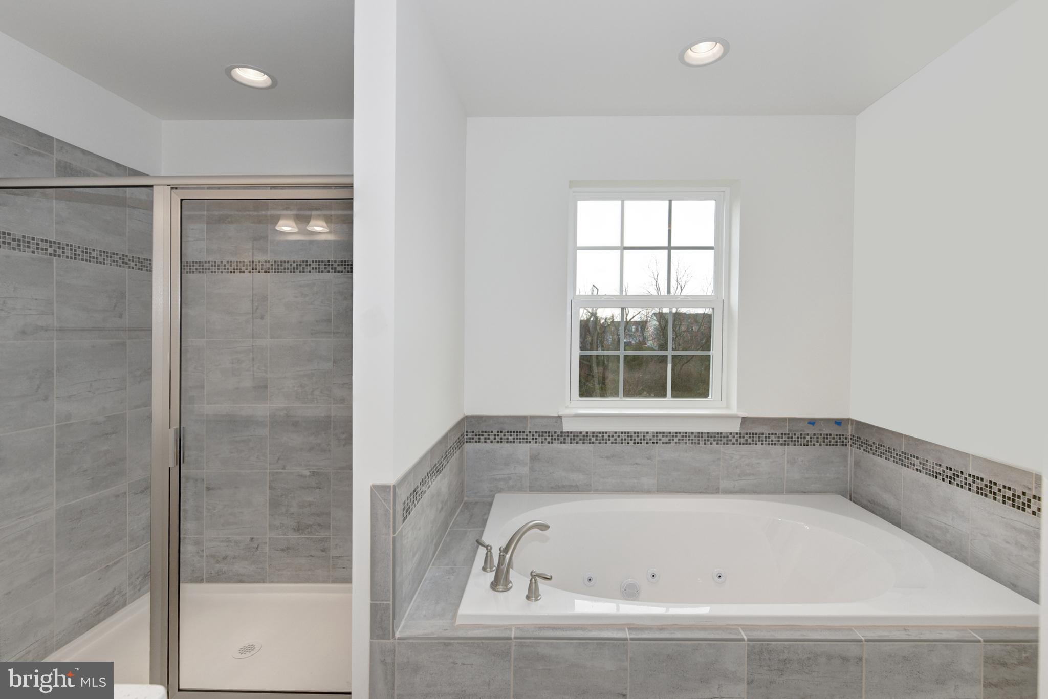 33 Seldon Drive, Unit 3 Smyrna, DE 19977 - Photo 18 of 24 a bathroom with a bathtub and shower
