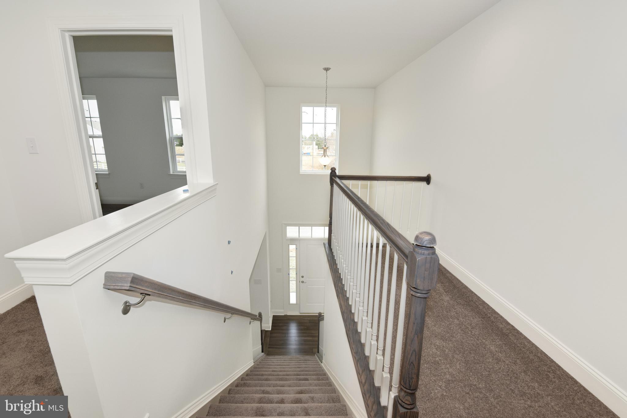 33 Seldon Drive, Unit 3 Smyrna, DE 19977 - Photo 20 of 24 a view of a hallway with staircase