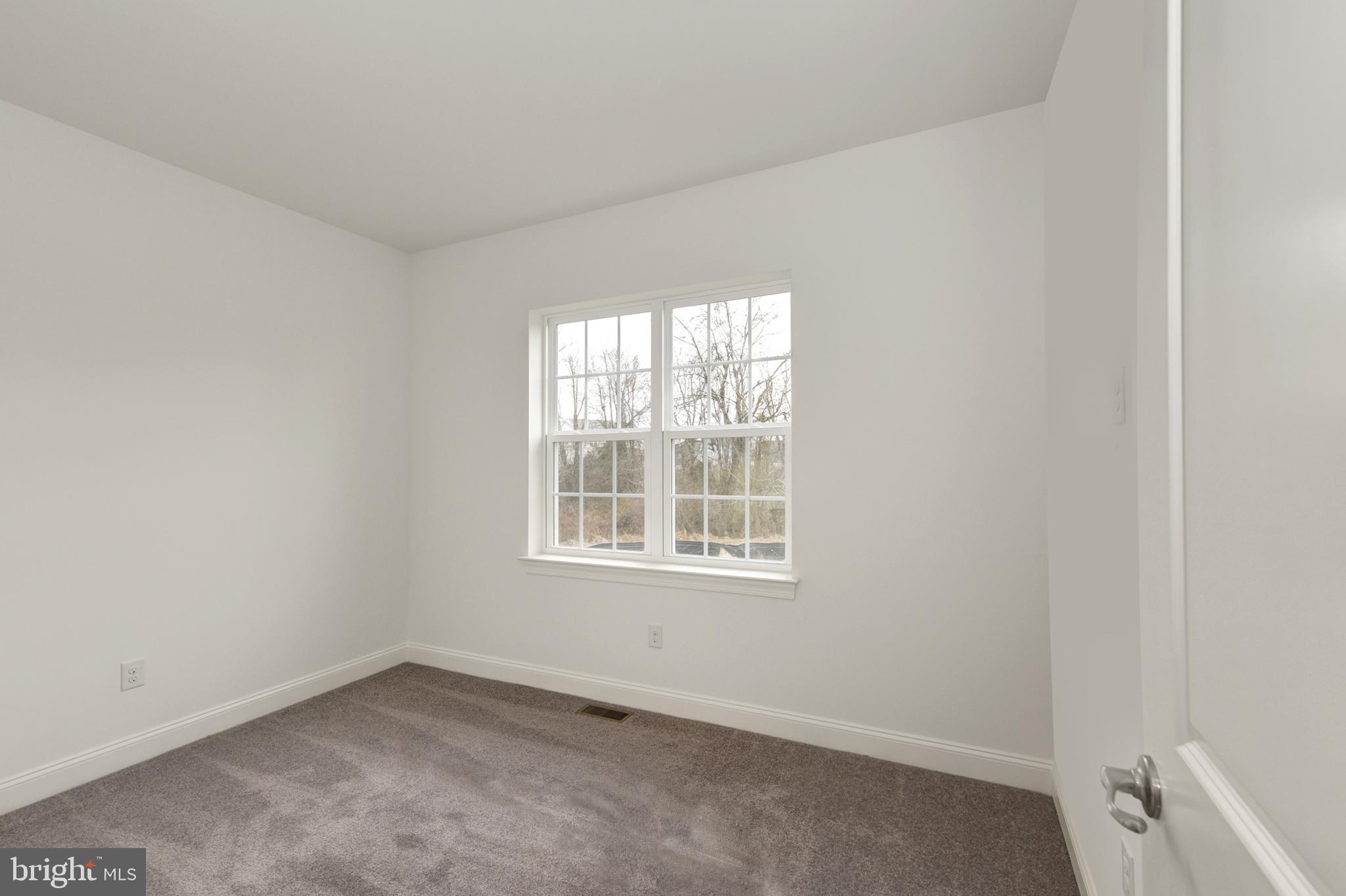 33 Seldon Drive, Unit 3 Smyrna, DE 19977 - Photo 22 of 24 an empty room with a window
