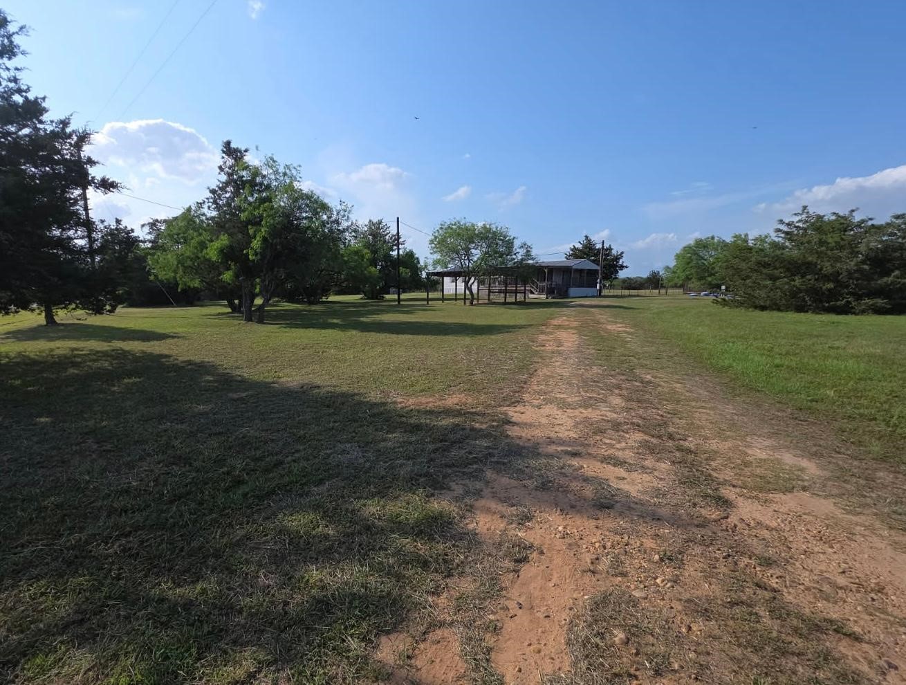 a view of a lake with houses in the background