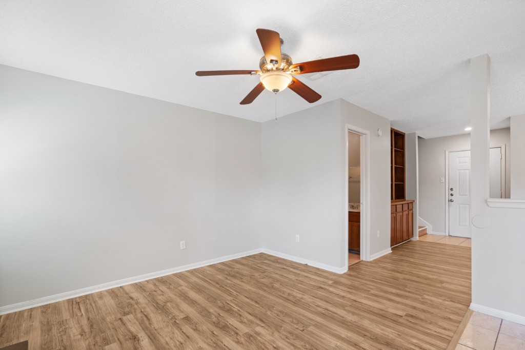 8703 Schick Road, Unit C Austin, TX 78729 - Photo 11 of 24 a view of empty room with wooden floor