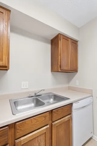 a kitchen with a sink and cabinets