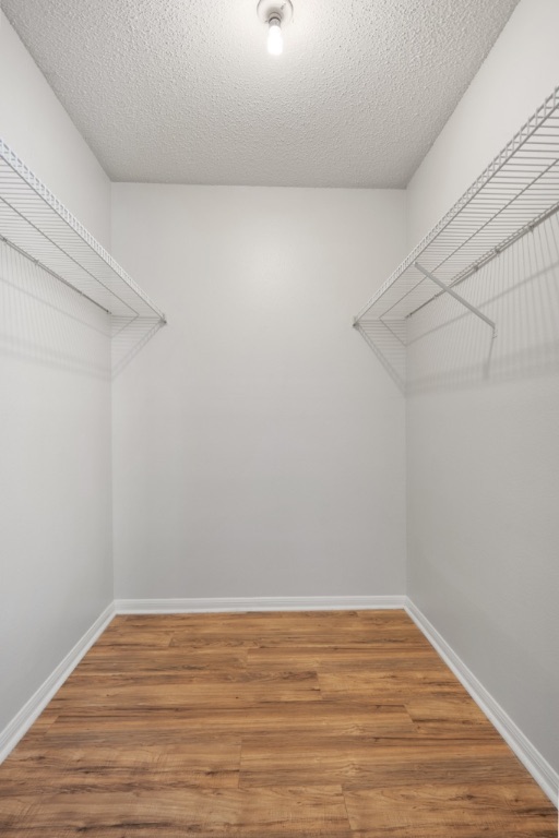 8703 Schick Road, Unit C Austin, TX 78729 - Photo 18 of 24 a view of a room with wooden floor