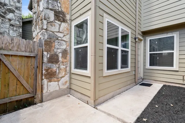 a view of front door of house with stairs