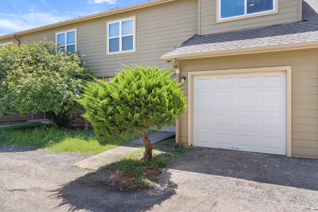 8703 Schick Road, Unit C Austin, TX 78729 - Photo 4 of 24 a view of a house with a yard