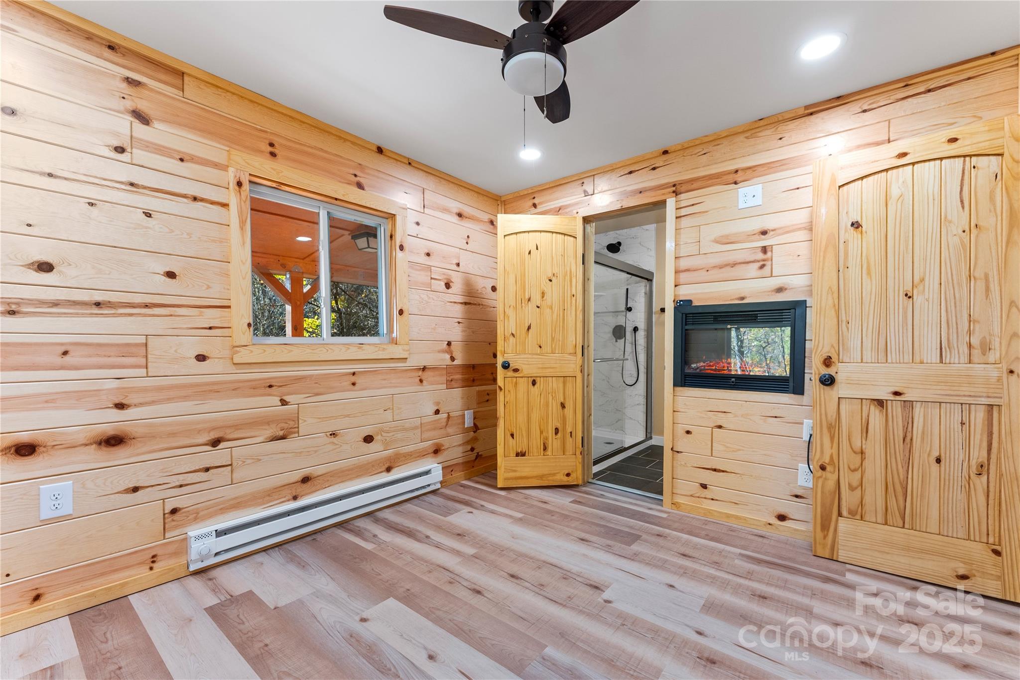 430 Long Branch Road Maggie Valley, NC 28751 - Photo 11 of 34 a view of a hallway with wooden floor and cabinet