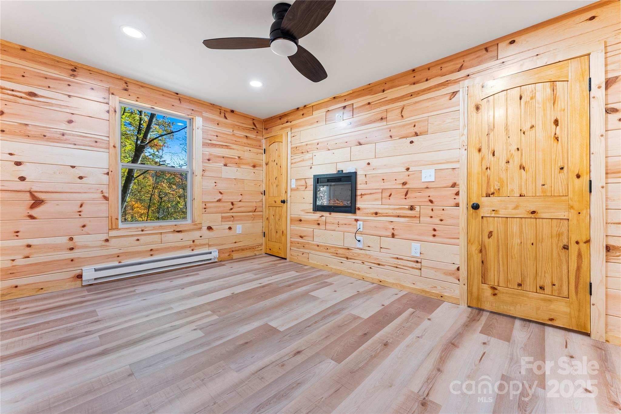 430 Long Branch Road Maggie Valley, NC 28751 - Photo 14 of 34 wooden floor in an empty room with a window