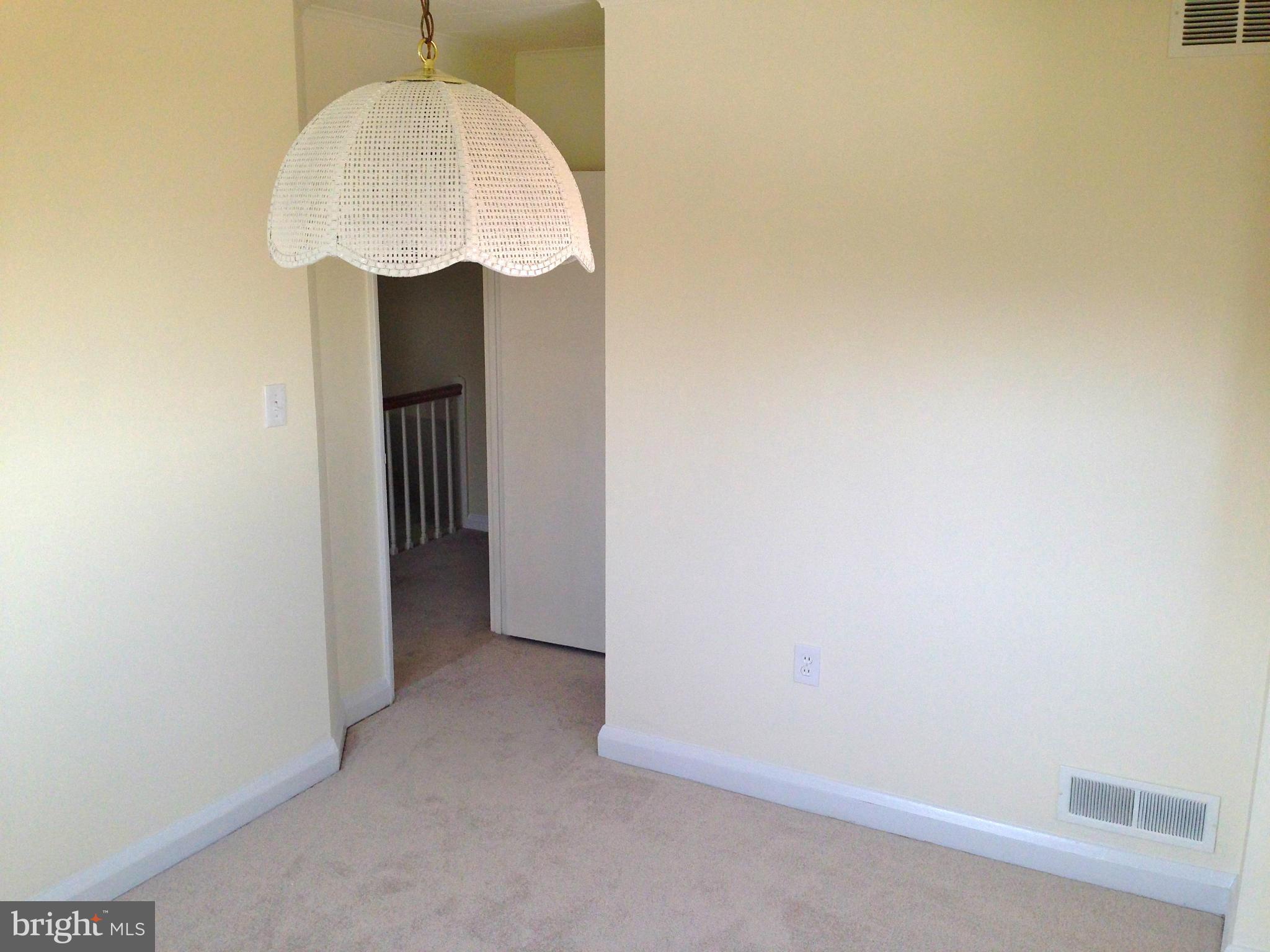 2739 Kirkleigh Road Baltimore, MD 21222 - Photo 21 of 30 a view of a hallway with a small space