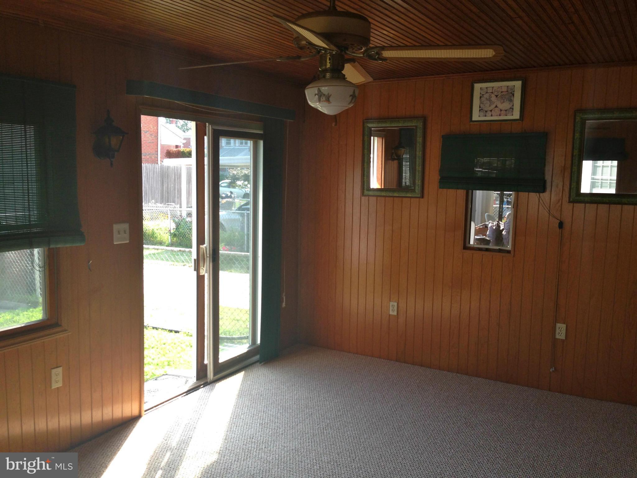 2739 Kirkleigh Road Baltimore, MD 21222 - Photo 22 of 30 a view of empty room with windows