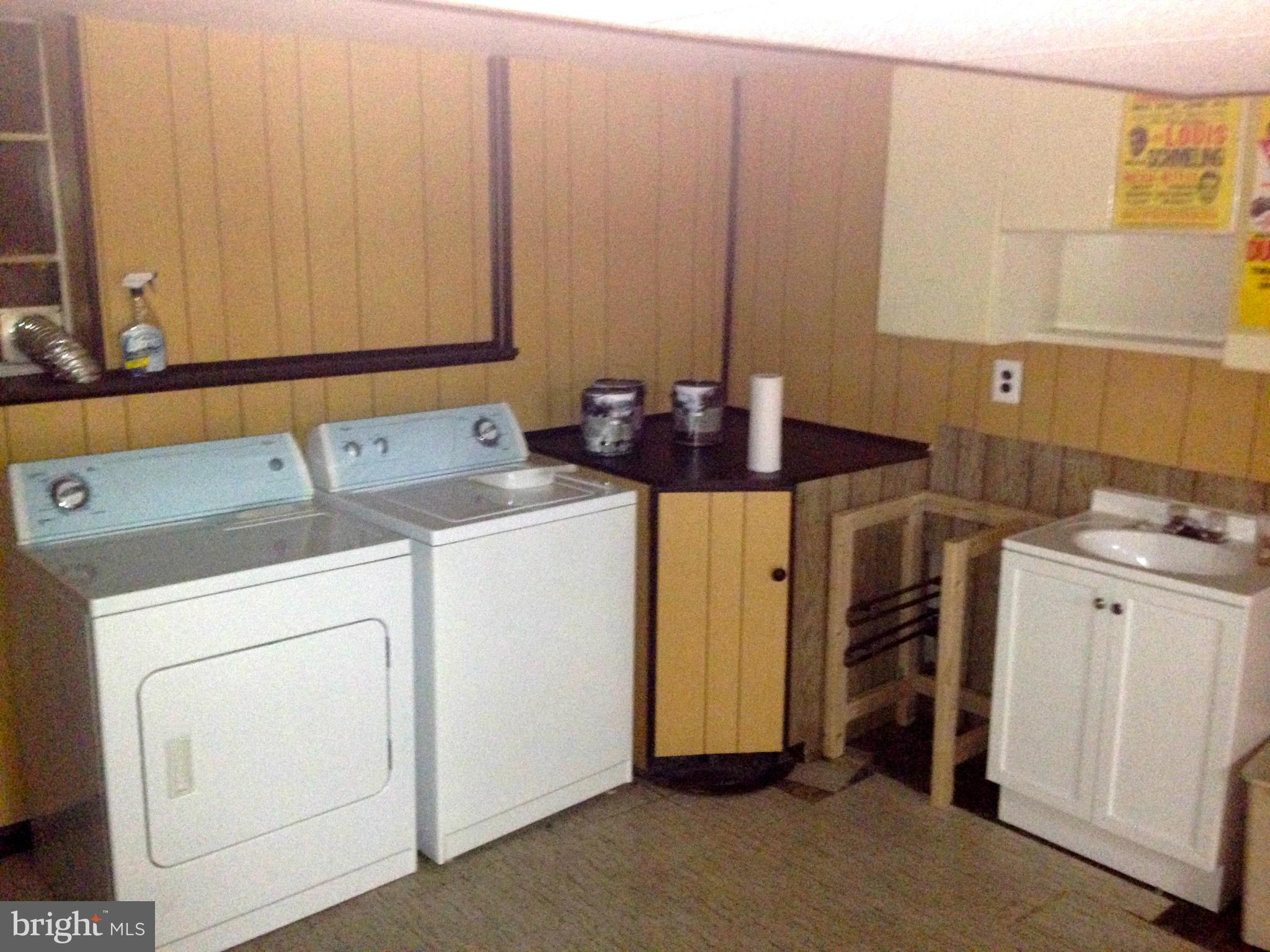 2739 Kirkleigh Road Baltimore, MD 21222 - Photo 26 of 30 a utility room with dryer and washer
