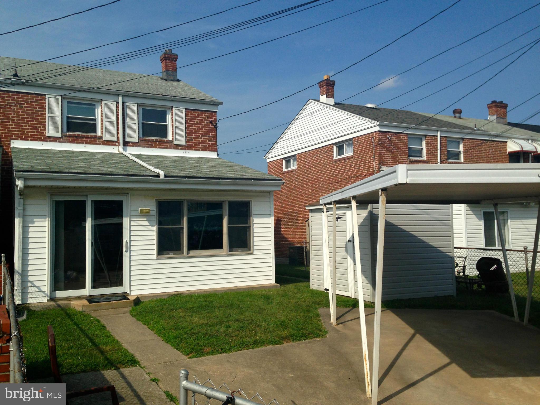 2739 Kirkleigh Road Baltimore, MD 21222 - Photo 29 of 30 a front view of a house with a yard