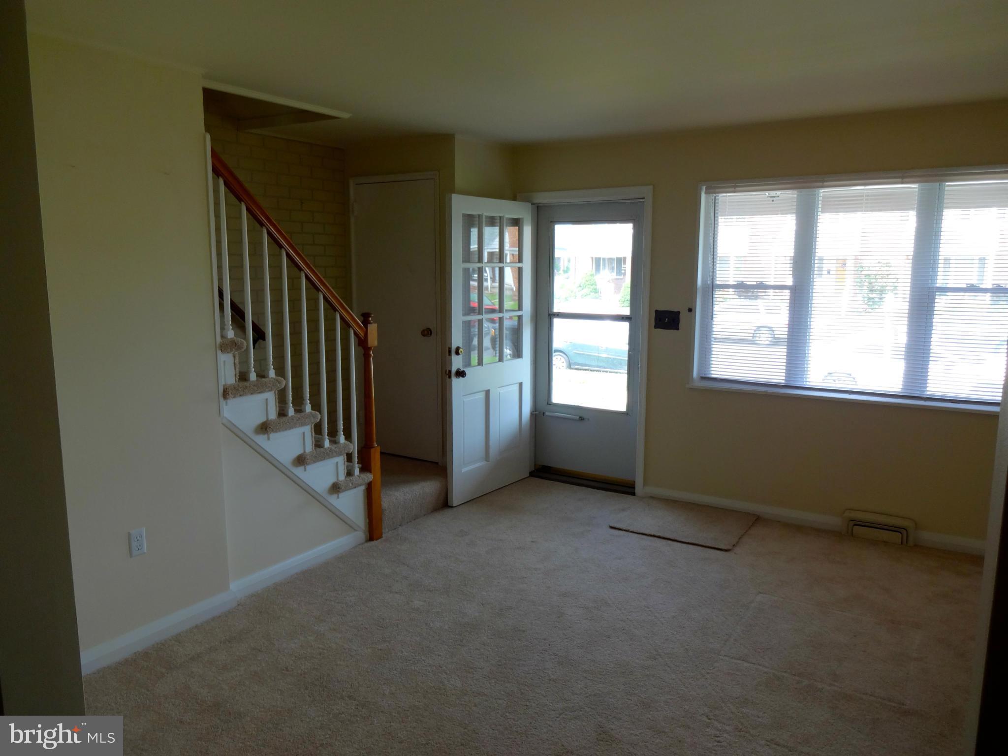 2739 Kirkleigh Road Baltimore, MD 21222 - Photo 5 of 30 an empty room with windows