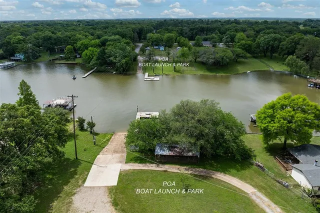 an aerial view of a house with a yard and a garden