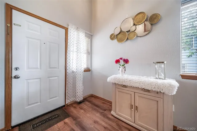 a bathroom with a granite countertop sink a mirror and vanity