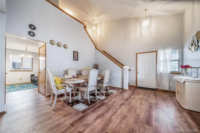 a workspace with wooden floor and white walls