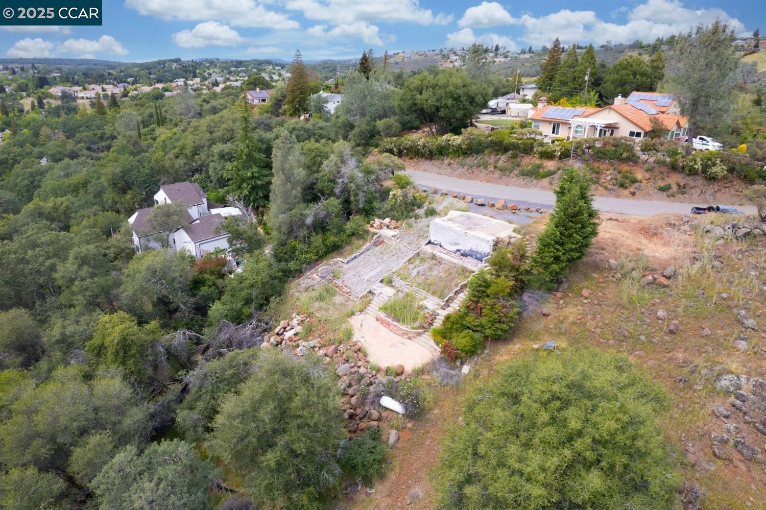 3098 Oakwood Road Cameron Park, CA 95682 - Photo 2 of 17 a view of a street with a houses