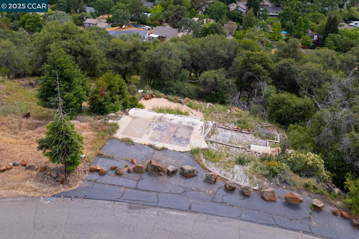 3098 Oakwood Road Cameron Park, CA 95682 - Photo 3 of 17 an aerial view of a house with a yard and greenery