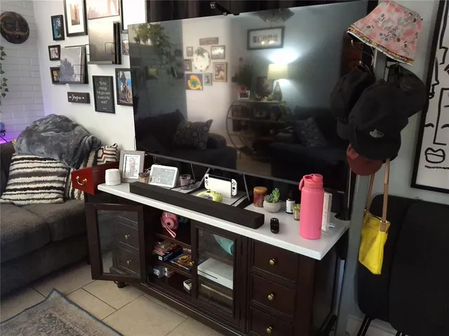 a kitchen with stainless steel appliances kitchen island granite countertop a sink stove and cabinets