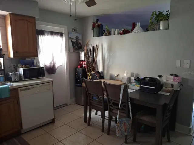 a dining room with furniture and window