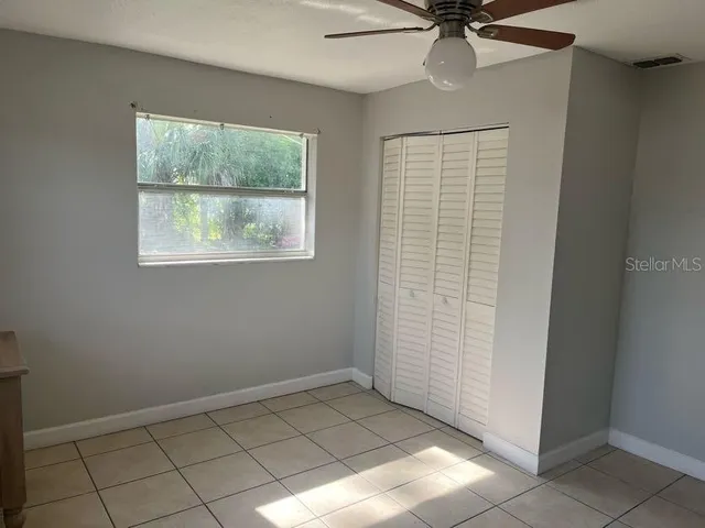 a kitchen with a refrigerator sink and cabinets