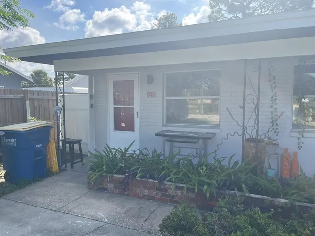 a view of house with yard and entertaining space