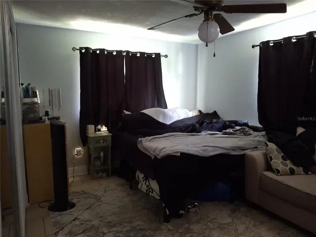 a bedroom with a bed and a closet