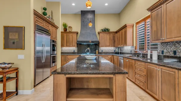 a bedroom with a large bed and a large window