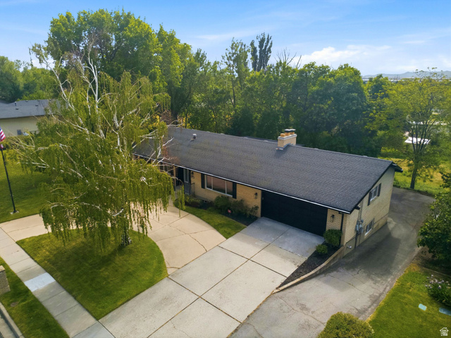 871 Bonita Way Centerville, UT 84014 - Photo 59 of 61 Ranch-style exterior with a dark shingle roof, attached two-car garage, and a light-colored brick facade