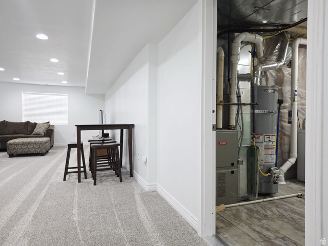 1437 925 South Vernal, UT 84078 - Photo 22 of 47 Finished basement featuring light-toned striped carpeting, white walls, and recessed lighting