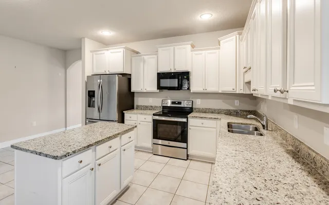 a front view of a house with yard