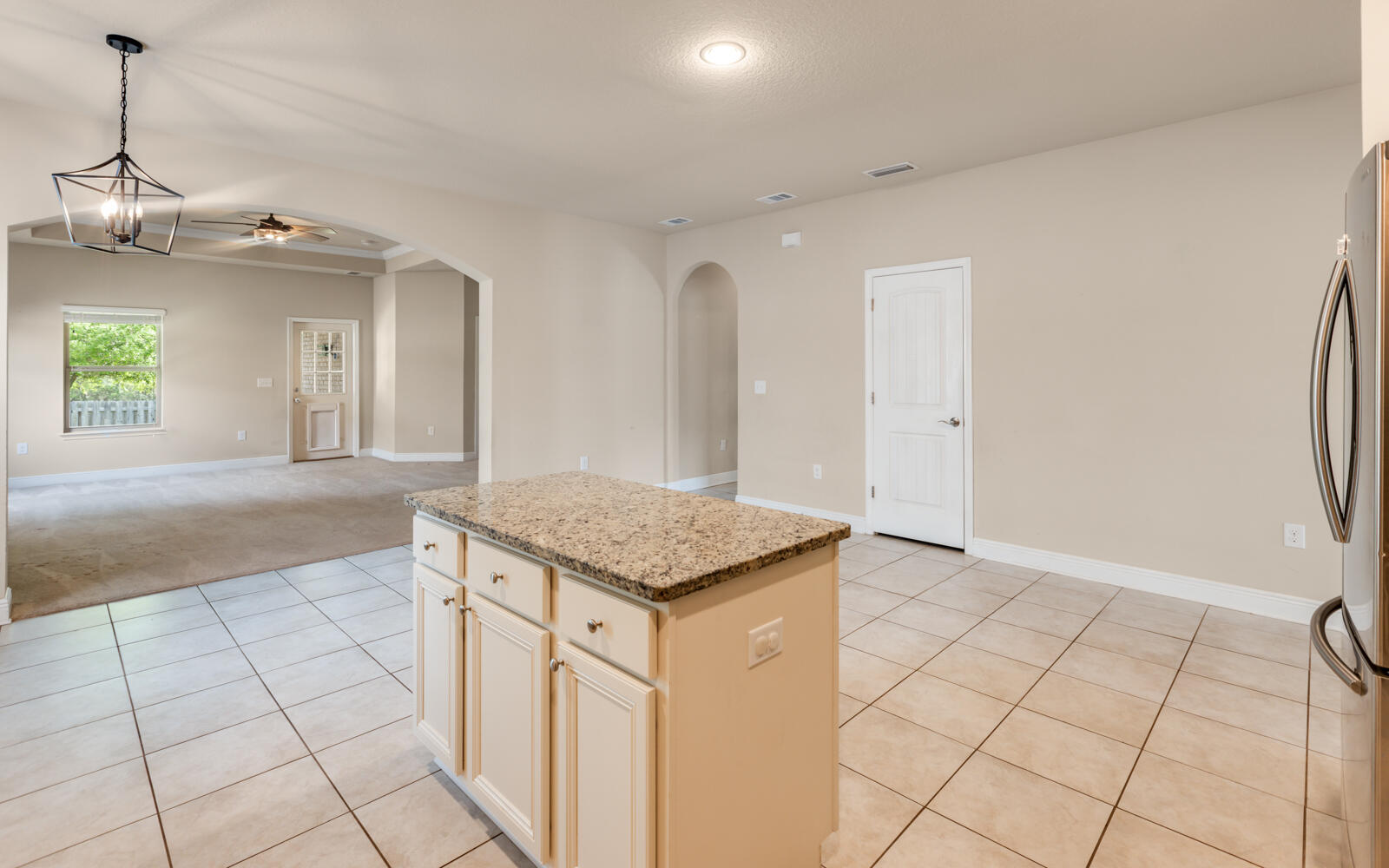 379 Whitman Way Freeport, FL 32439 - Photo 17 of 97 a kitchen with stainless steel appliances granite countertop a refrigerator a sink and dishwasher