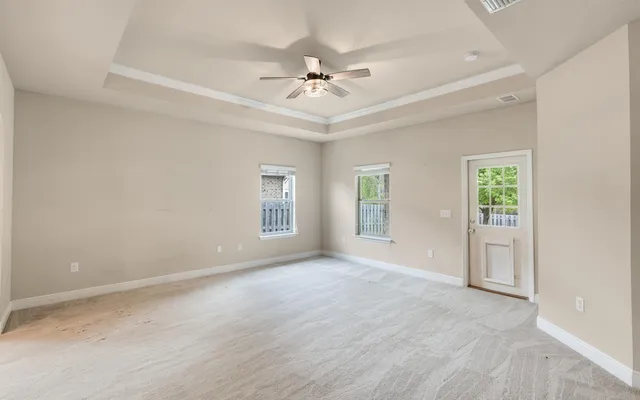 a bathroom with a granite countertop sink a toilet and shower